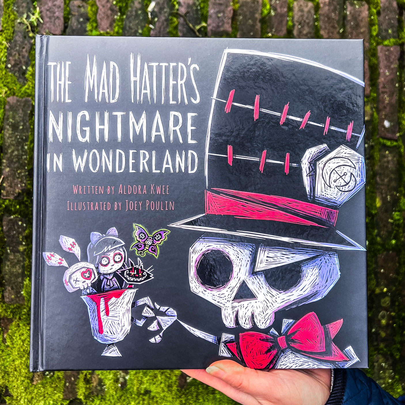 Gothic storybook cover featuring Mad Hatter in dark Wonderland theme