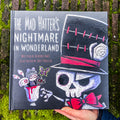 Gothic storybook cover featuring Mad Hatter in dark Wonderland theme